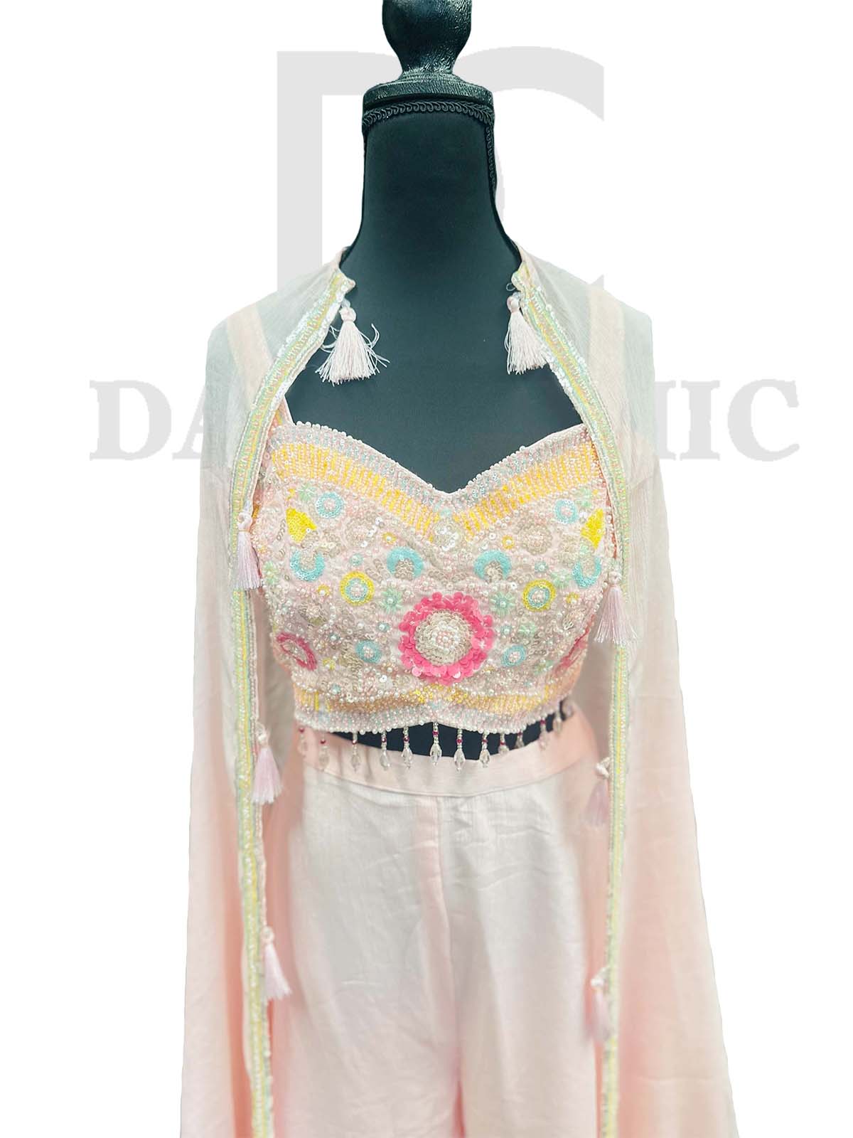 Off-white flared palazzo and crop top in Resham embroidery.