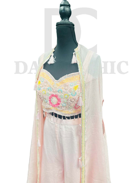 Off-white flared palazzo and crop top in Resham embroidery.